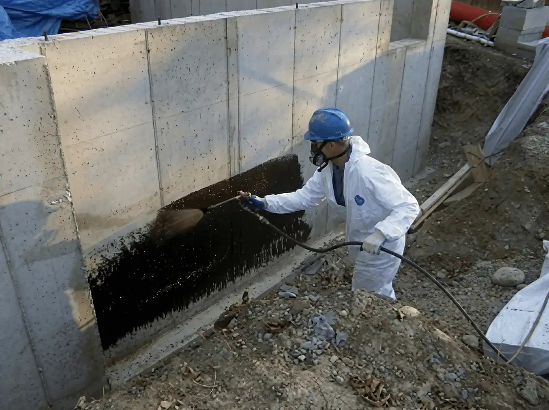 Professional waterproofing the exterior walls of the basement in Hollywood, FL